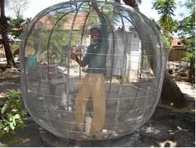 Locally trained mason constructing RWH tank